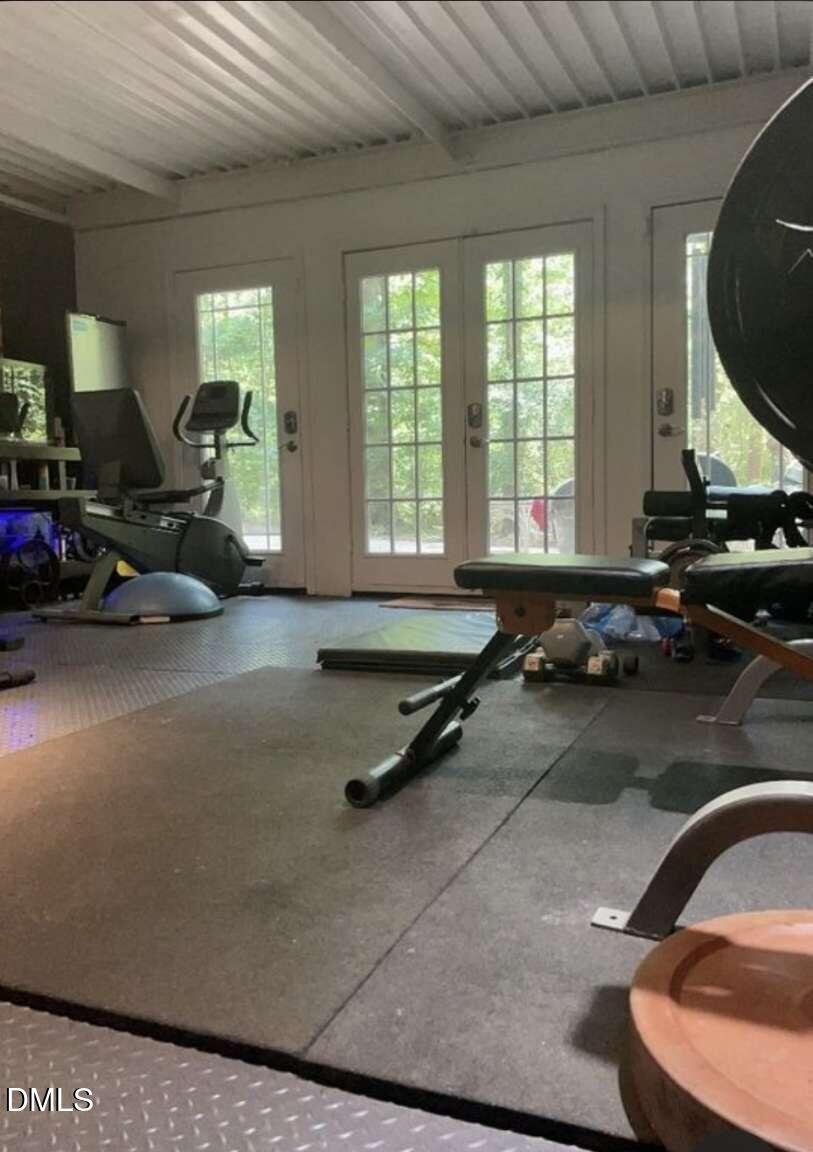 1204 Queensferry Road Cary, NC 27511 - Photo 46 of 50 a room with gym equipment and a large window