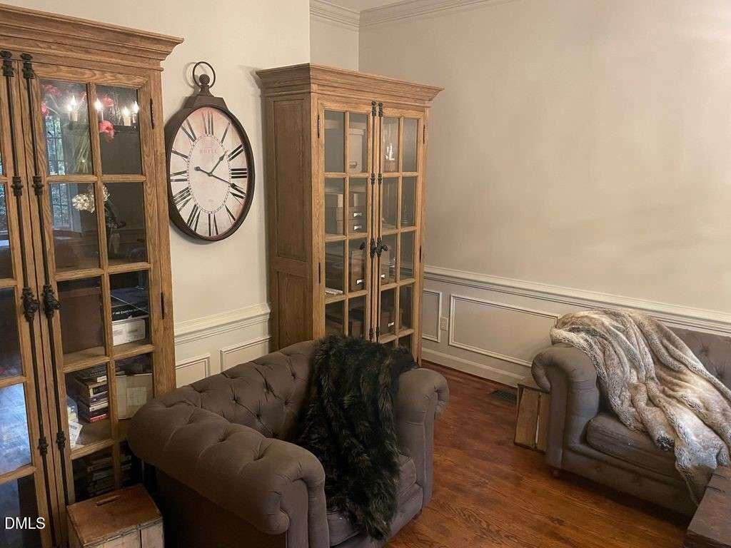 1204 Queensferry Road Cary, NC 27511 - Photo 7 of 50 a living room with furniture and a clock