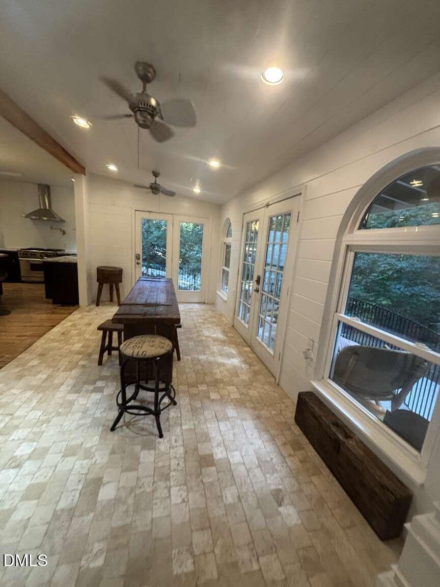 1204 Queensferry Road Cary, NC 27511 - Photo 10 of 50 a living room with furniture and a floor to ceiling window