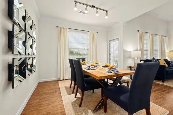 a view of a dining room with furniture and window