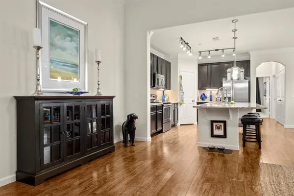 a view of kitchen with cabinets and window