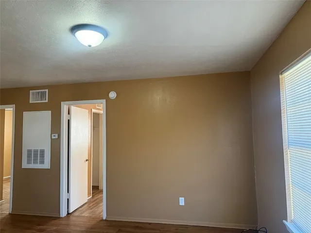 a white toilet sitting next to a bath tub