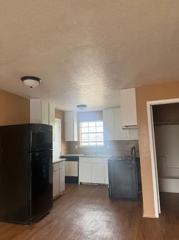 a bathroom with a toilet sink and window