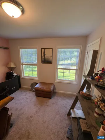 a bathroom with a sink mirror and shower