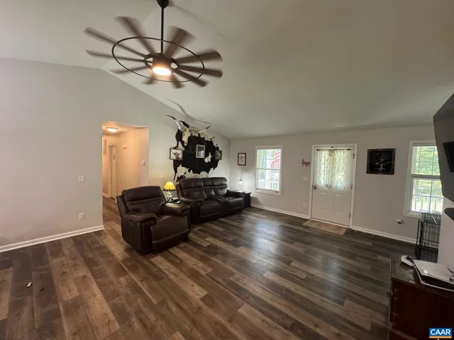 a large kitchen with a table and chairs