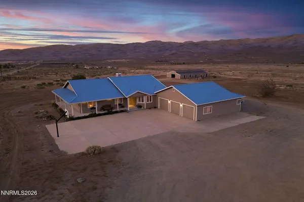 a aerial view of a house with a ocean view