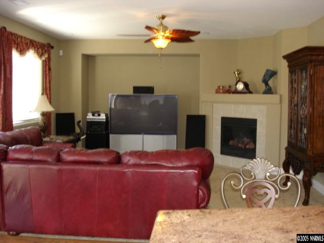 2505 Perryville Drive Reno, NV 89521 - Photo 5 of 8 a living room with furniture and a fireplace