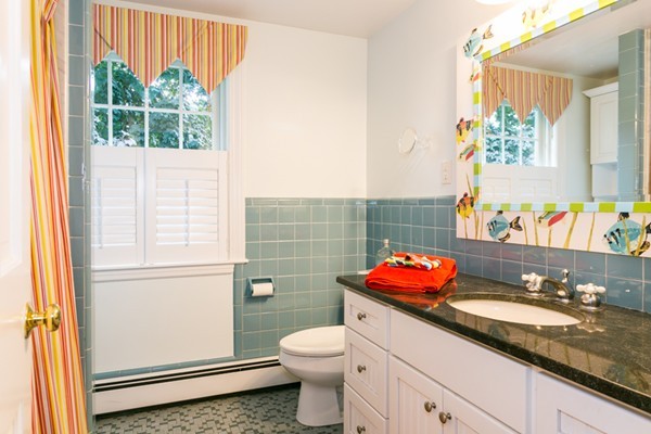 211 Tudor Road Needham, MA 02492 - Photo 18 of 26 a bathroom with a granite countertop toilet sink and mirror