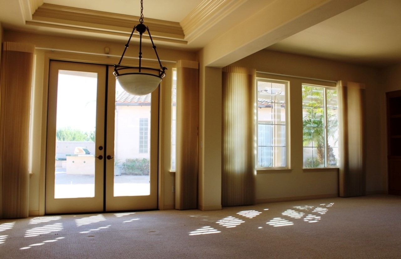 13635 Overland Pass Road Poway, CA 92064 - Photo 18 of 25 Between kitchen and formal living room with french doors that lead to garden.