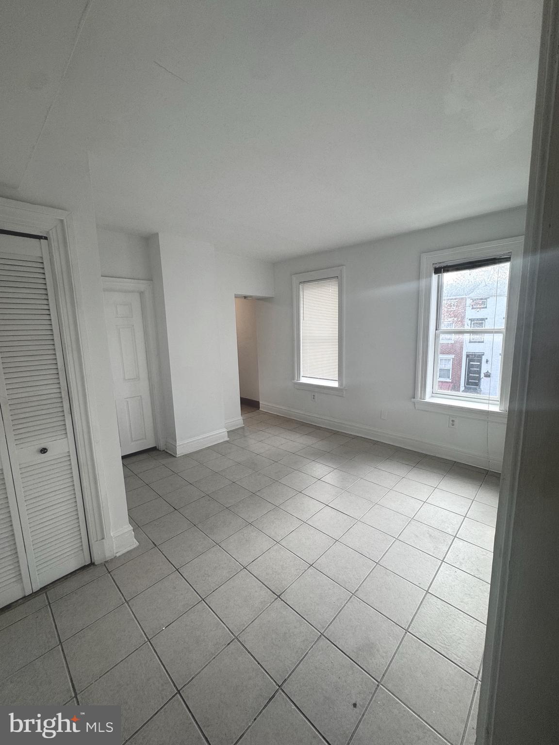 31 South Arlington Avenue Baltimore, MD 21223 - Photo 8 of 10 an empty room with windows