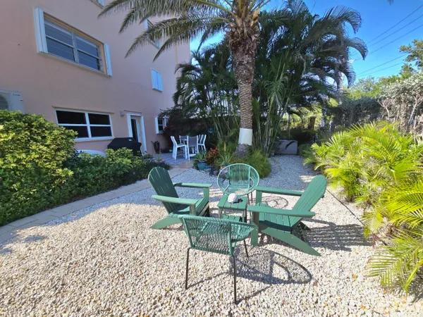 a view of a basketball court with buildings in the background