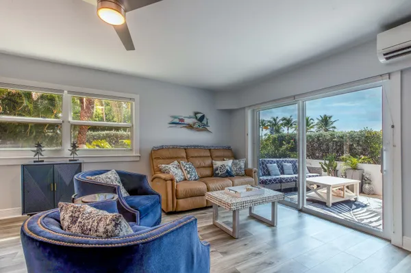 a view of a chairs and table in patio