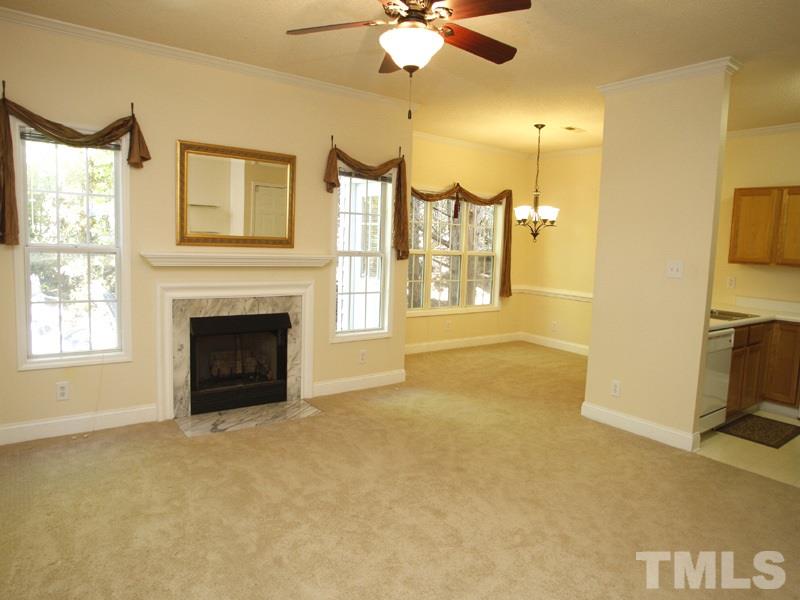 4005 Beaufain Street Raleigh, NC 27604 - Photo 3 of 12 a view of a livingroom with a fireplace