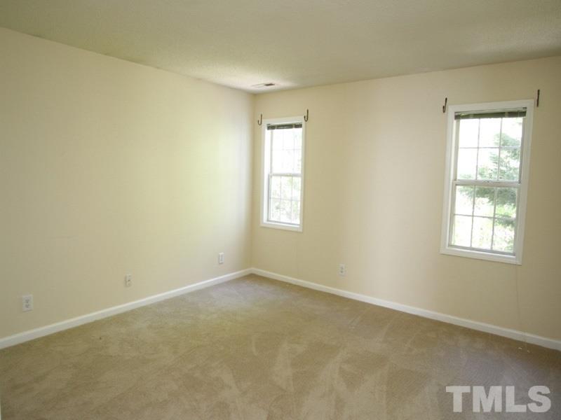 4005 Beaufain Street Raleigh, NC 27604 - Photo 8 of 12 an empty room with windows