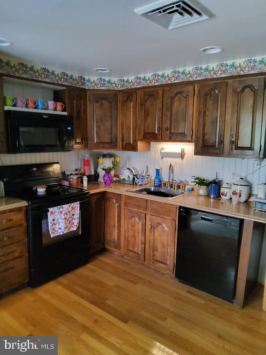 1222 Hillside Road Pasadena, MD 21122 - Photo 17 of 50 Charming kitchen with rustic appeal.