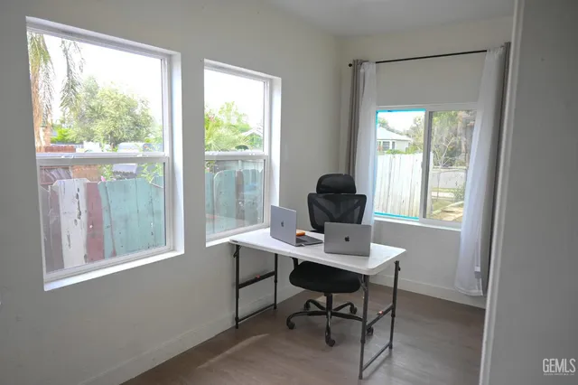 a bedroom with a bed and a table