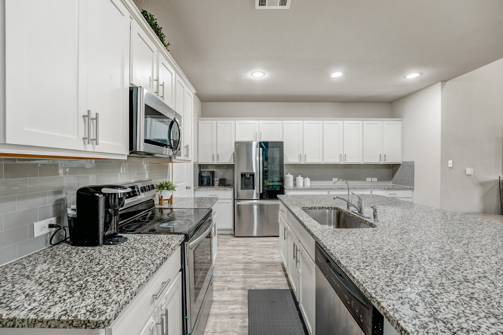 633 Donegal Lane Georgetown, TX 78626 - Photo 14 of 21 a kitchen with a sink stove top oven and refrigerator