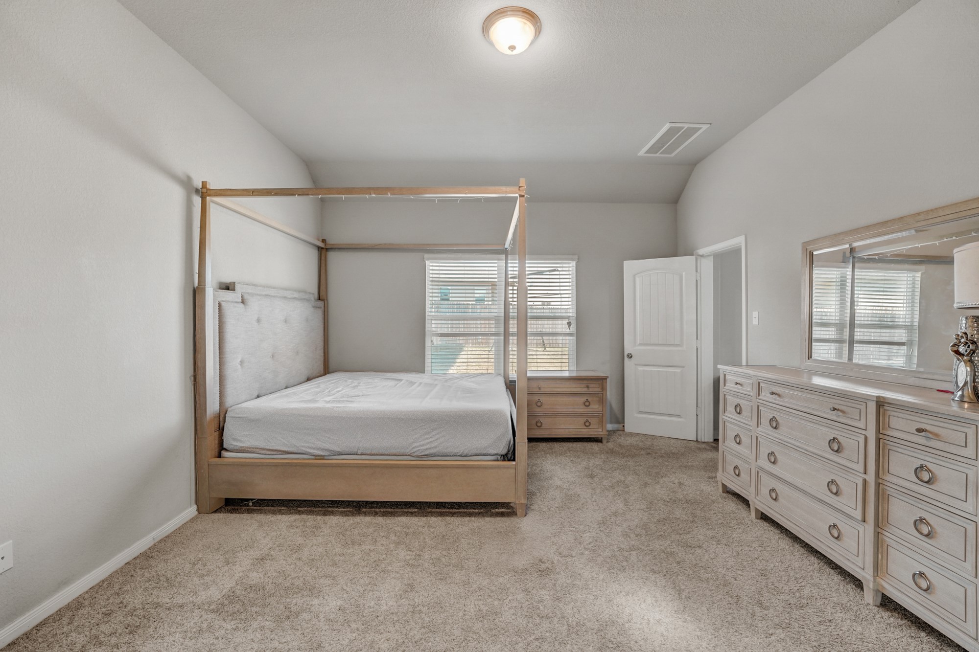 633 Donegal Lane Georgetown, TX 78626 - Photo 17 of 21 a spacious bedroom with a bed and a dresser