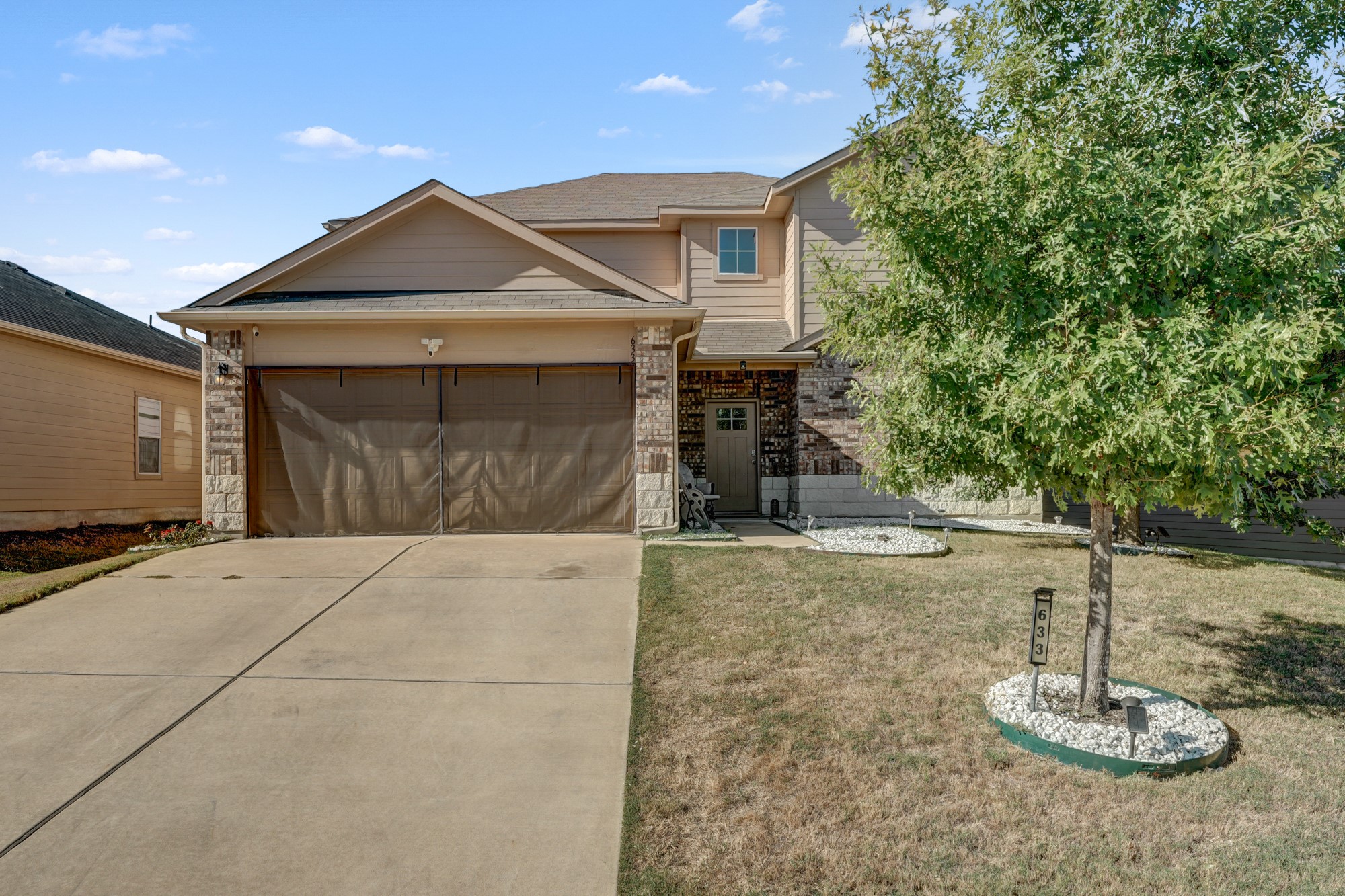 633 Donegal Lane Georgetown, TX 78626 - Photo 2 of 21 a front view of a house with a yard
