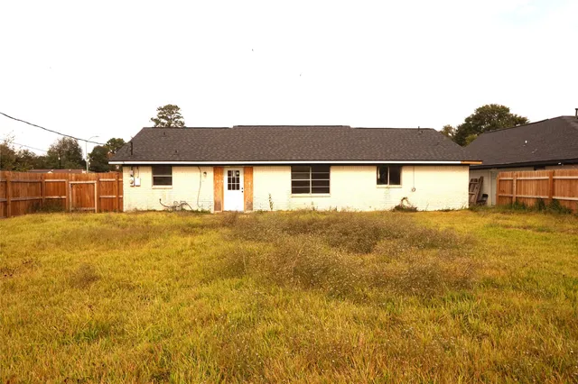a view of a yard with a large tree