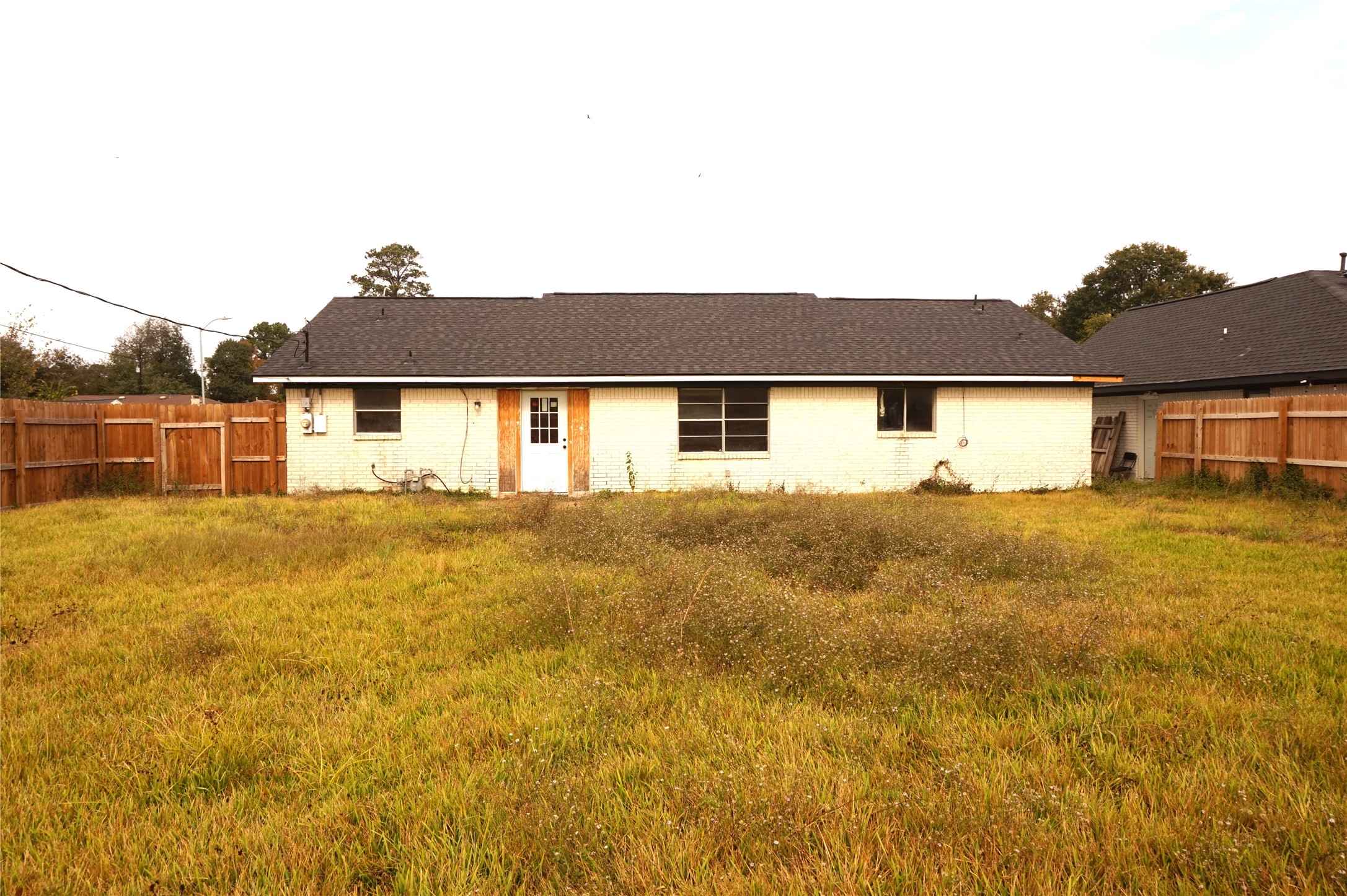 15902 Dunman Lane Houston, TX 77044 - Photo 25 of 28 a front view of a house with a yard