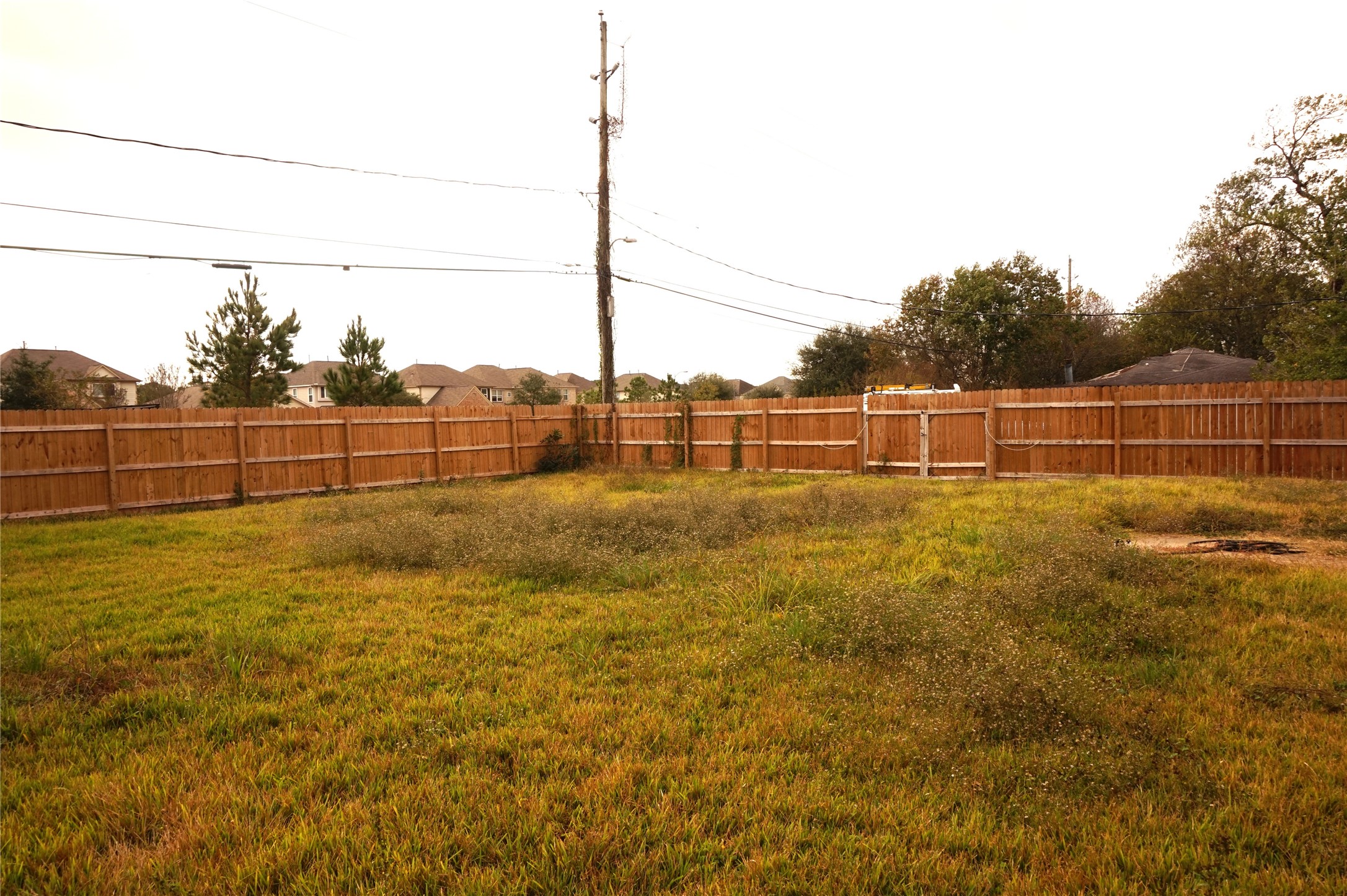 15902 Dunman Lane Houston, TX 77044 - Photo 26 of 28 a view of a yard with wooden fence