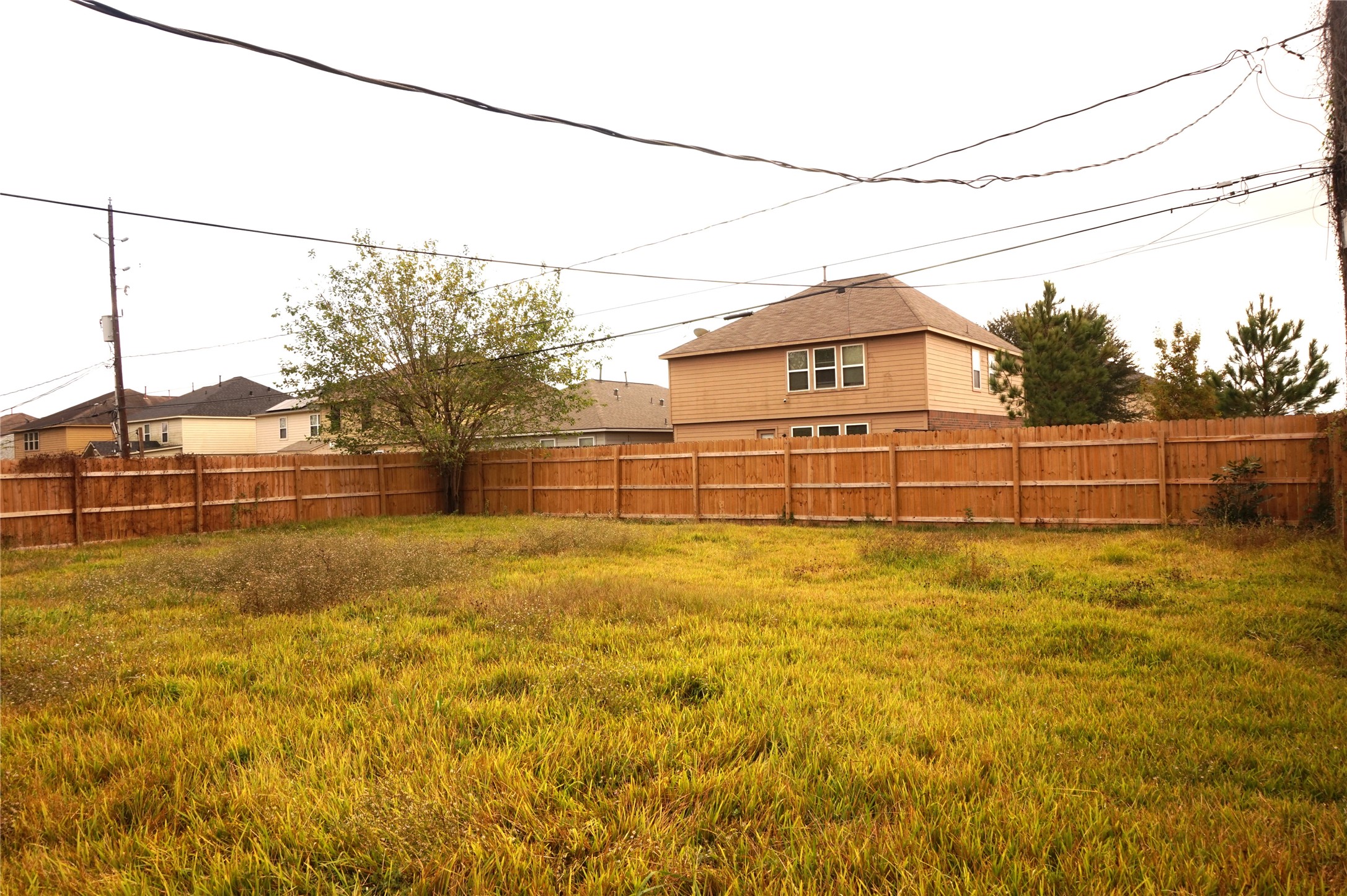 15902 Dunman Lane Houston, TX 77044 - Photo 28 of 28 a view of a yard with wooden fence