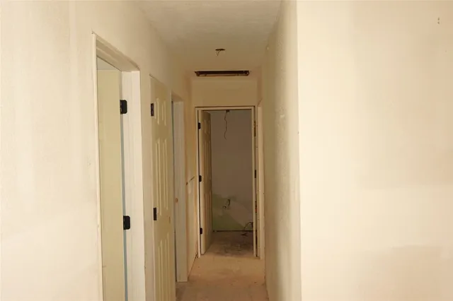 a view of a bathroom from a hallway