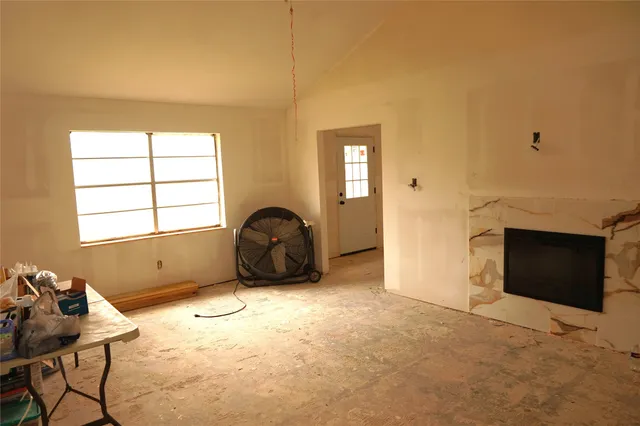 a room with furniture and a window