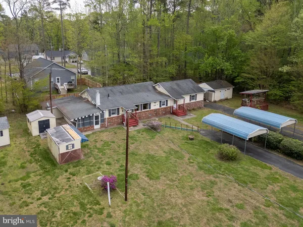 an aerial view of a house with pool and mountain view