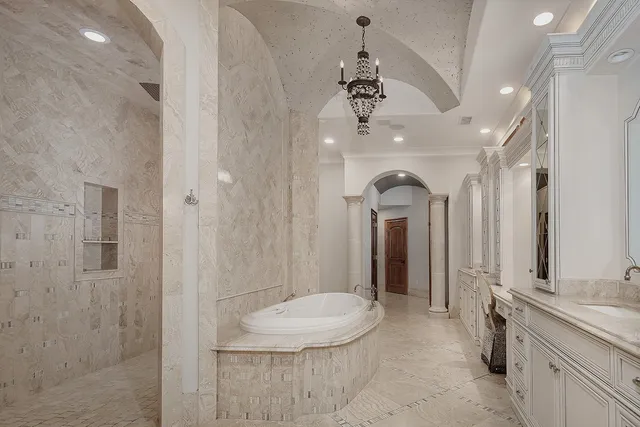 a bathroom with a double vanity sink and a mirror