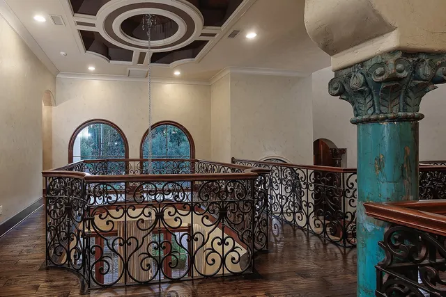 a view of entryway with a table and wooden floor