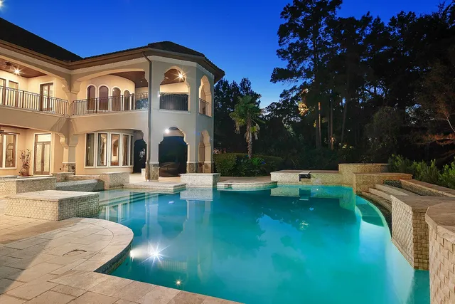 a view of swimming pool with a patio