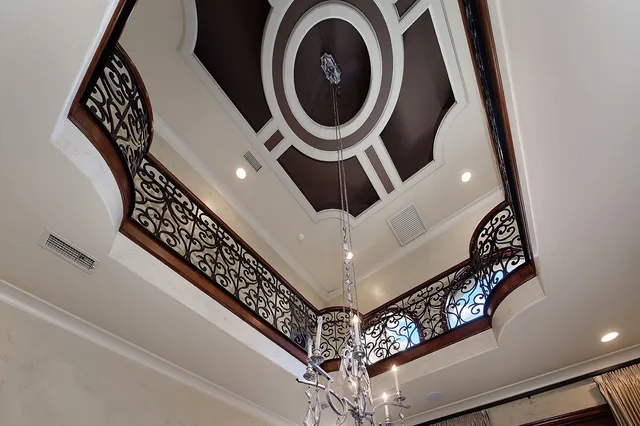 a view of an entryway with a flower pot and wooden floor