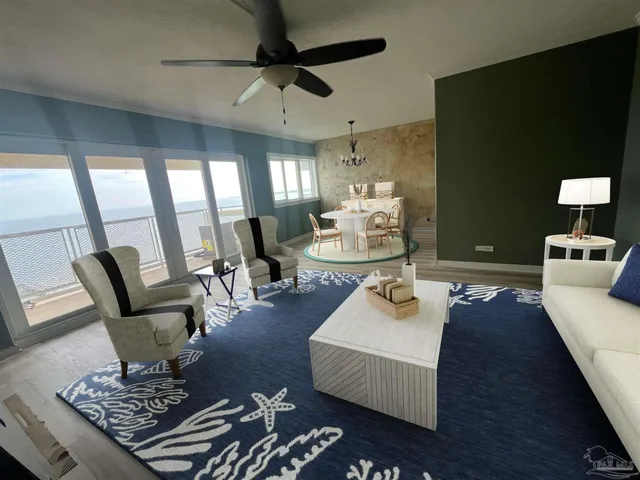 a living room with furniture and a chandelier