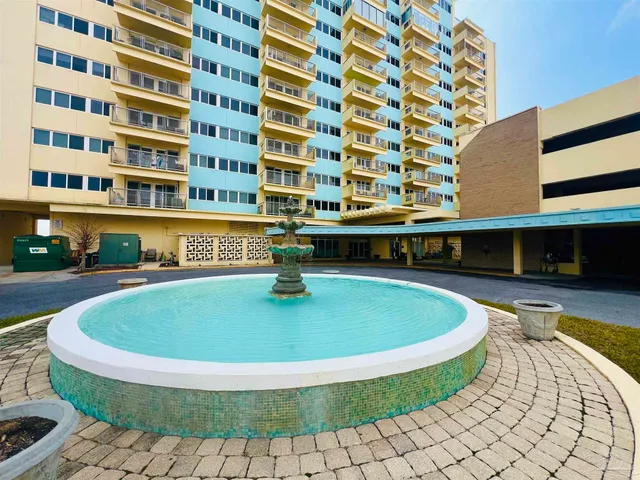 a view of a swimming pool with a lounge chairs