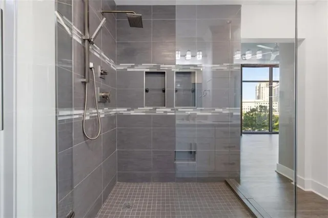 a bathroom with a glass shower door