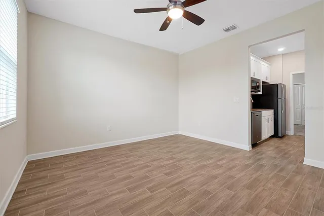 a view of an empty room with a window