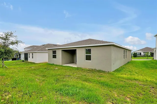 a view of a swimming pool with lounge chair