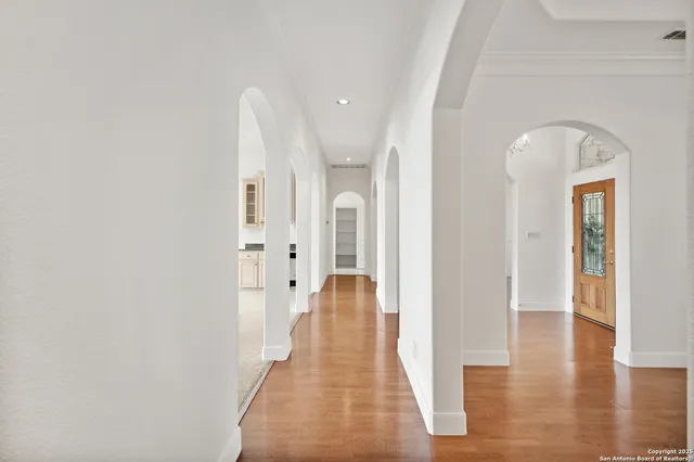 a view of a hallway with windows