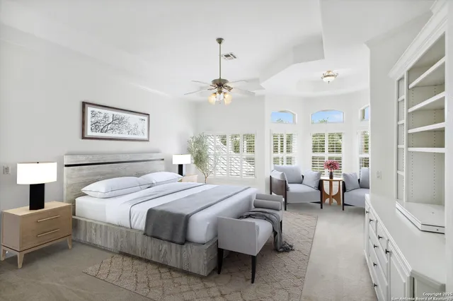 a view of a livingroom with furniture fireplace and window