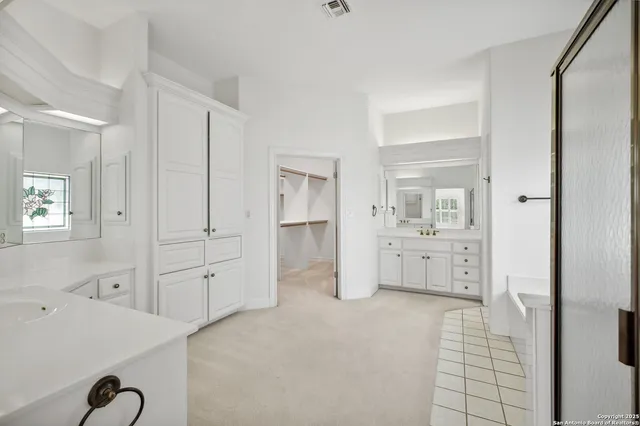 a view of a patio with table and chairs