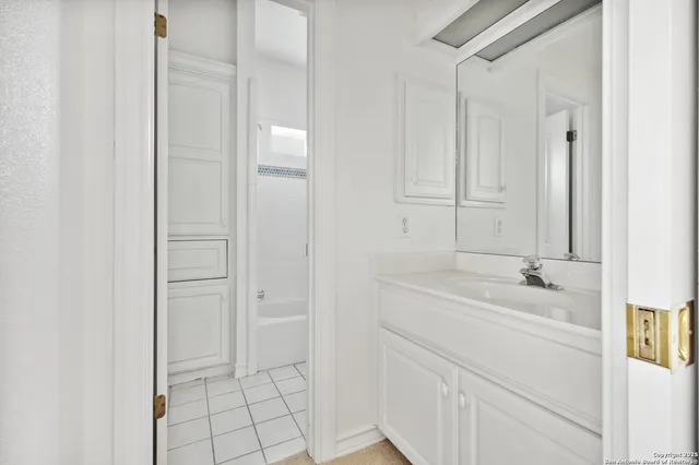 a view of a bench in backyard of house