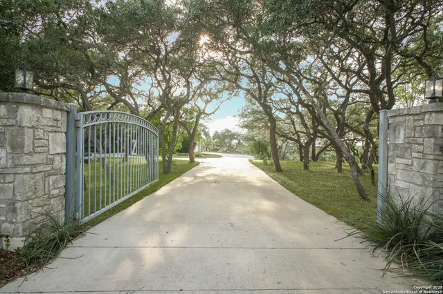 a dining room with furniture a chandelier and window