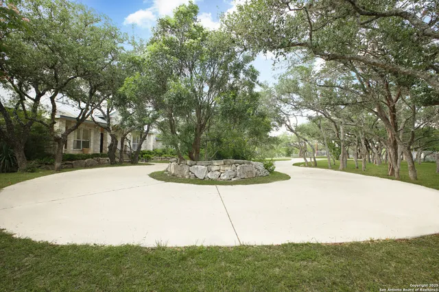 a view of a room with wooden floor and windows