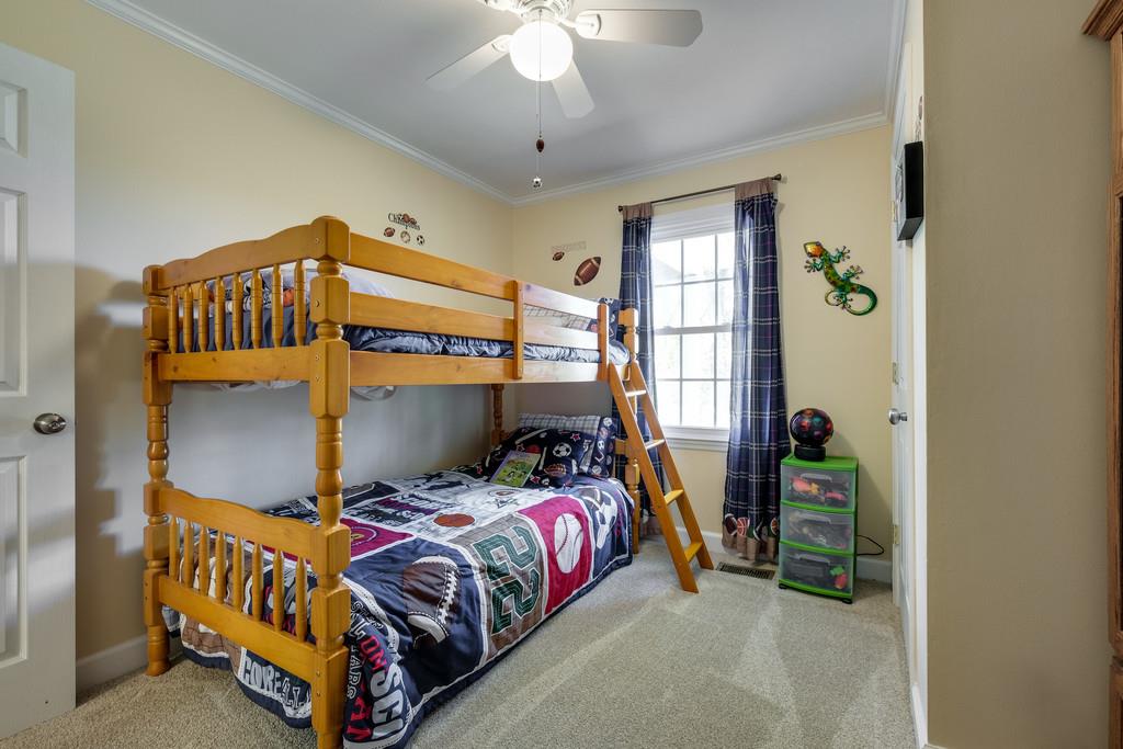6615 Slaughter Road Santa Fe, TN 38482 - Photo 23 of 30 a bedroom with a bed and a window