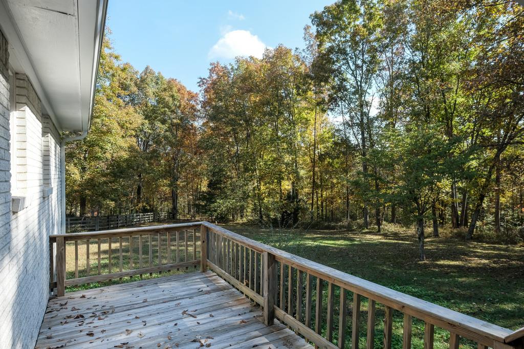 6615 Slaughter Road Santa Fe, TN 38482 - Photo 26 of 30 a view of balcony with wooden floor and fence