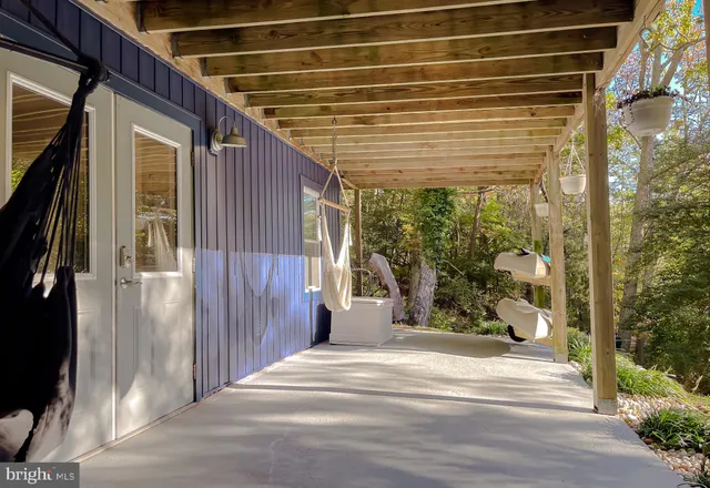 a kitchen with granite countertop white cabinets and stainless steel appliances