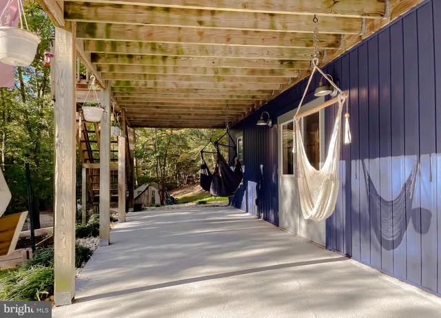 a kitchen with furniture a counter top space stainless steel appliances and cabinets