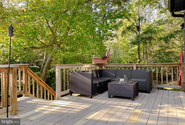 a kitchen with granite countertop white cabinets and a sink